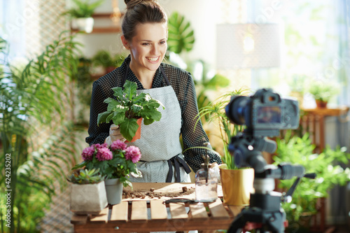 happy female records gardening educational video tutorials