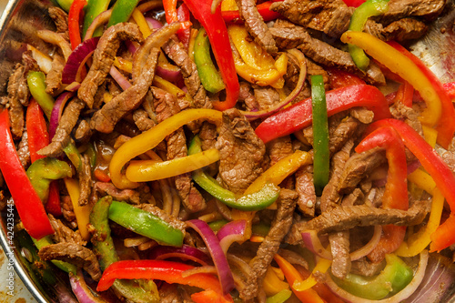 Billede på lærred Cooking Mexican Steak Fajitas