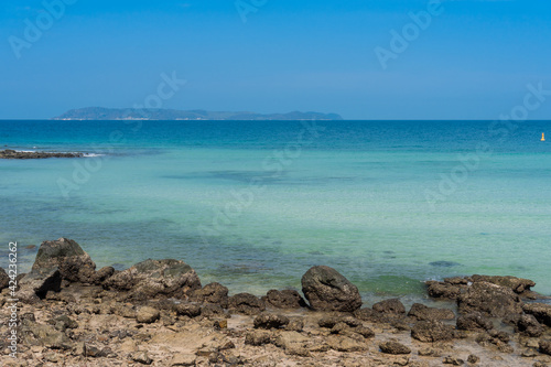 rocks sand beach with clear blue sea landscape, calm and relax seascape view, Thian beach at Koh Larn island, Thailand