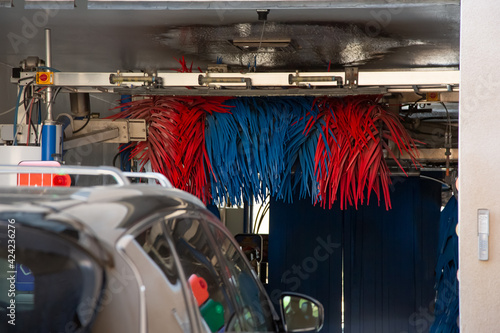 A view of a car entering an automated car wash facility.