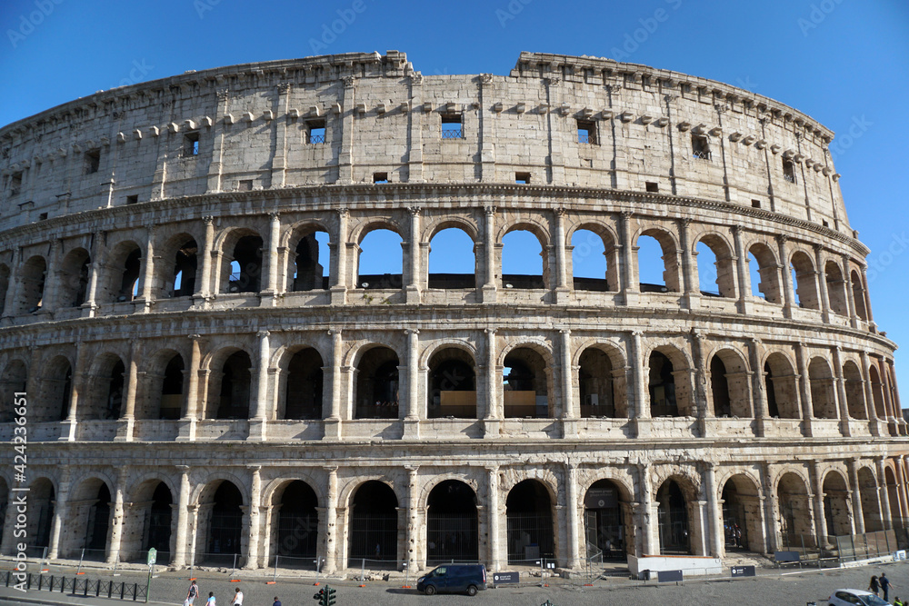 Ancient roman Colosseum in a sunny day.
Facade of the famous Roman amphitheater.
Ancient architecture and art.