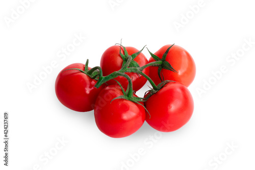 five fresh tomatoes with green leaves isolated on white background
