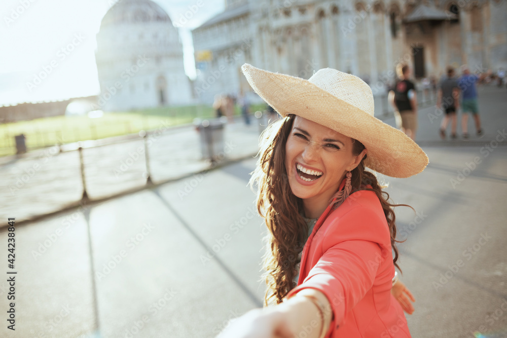 smiling stylish woman exploring attractions with boyfriend