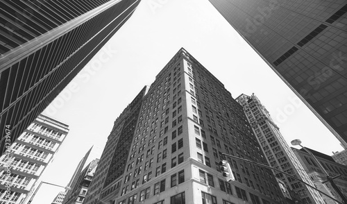 Looking up at Manhattan buildings  black and white picture  New York City  USA.