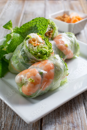 A closeup view of spring rolls on a plate.