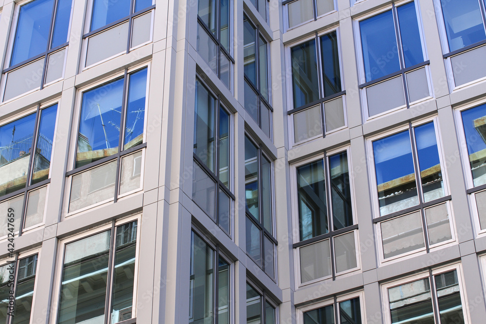 Office building in Rome, concrete structure, large reflecting windows.