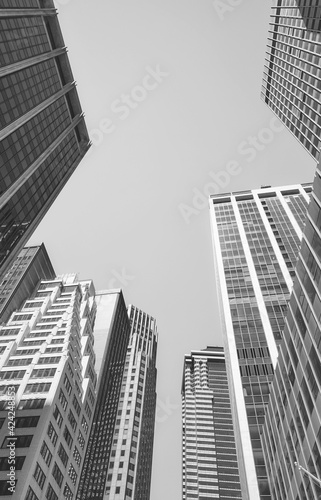 Looking up at Manhattan buildings  black and white picture  New York City  USA.
