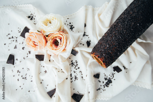 New Kurtos Kalacs, traditional Hungarian food, also known as chimney cake with amazing  chocolate flavor on a rustic tablecloth.  photo