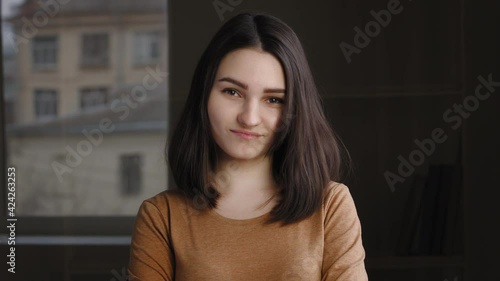 Close-up headshot female portrait indoors disgruntled offended disappointed girl caucasian woman model teenager waving shaking head negatively saying no answering refusal denial expresses disagreement