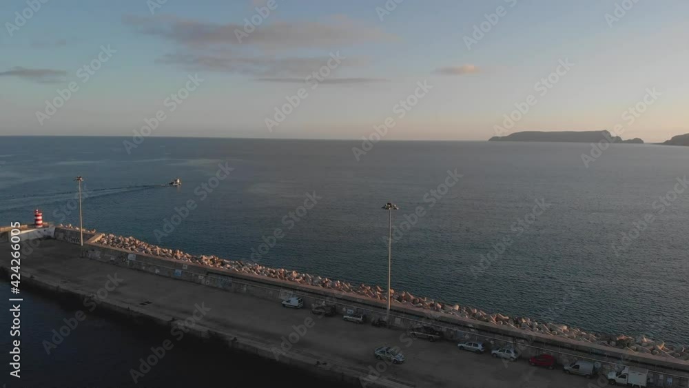 Aerial forward over pier with coast in background Aerial forward over pier with coast in background
