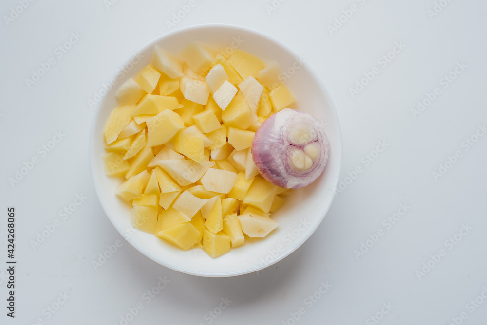 chopped potatoes and onions in a plate