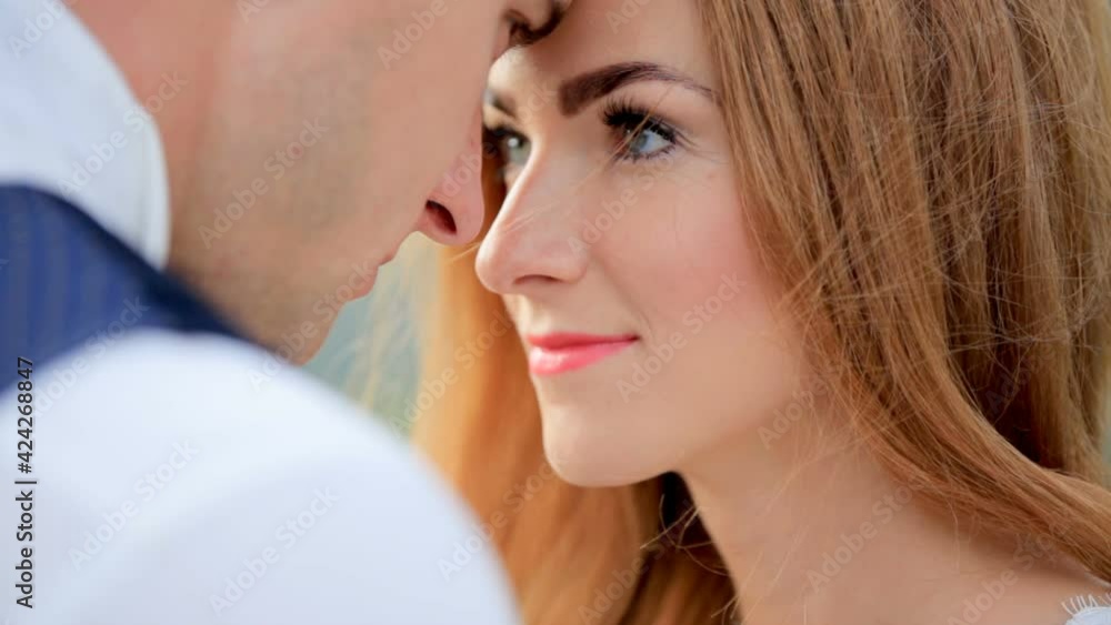 Beautiful bride and groom in love, tender feelings. Close-up Beautiful bride and groom in love, tender feelings. Close-up