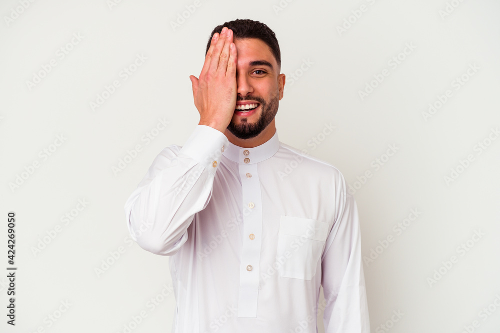 Young arab man wearing typical arab clothes isolated on white background