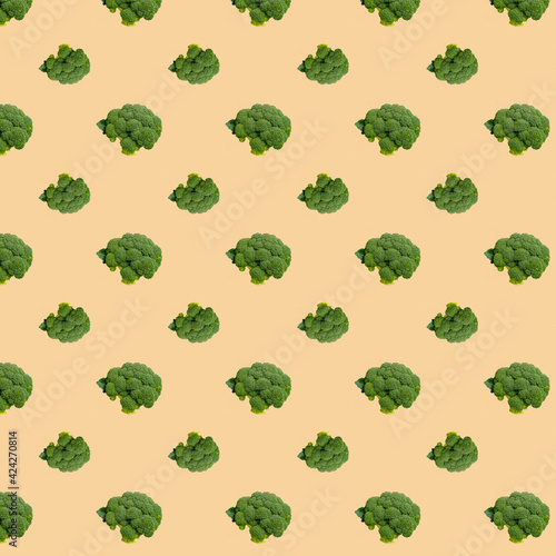 Broccoli seamless pattern on a beige background.