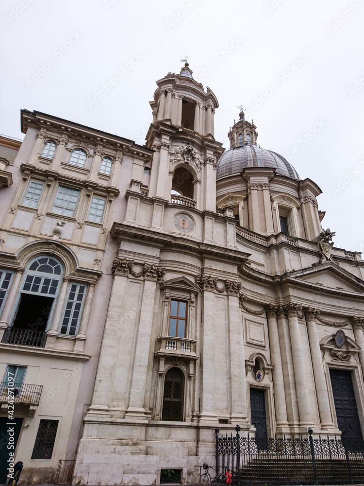 Sant'Agnese in Agone baroque church facade view at martyrdom site with frescoes. 17th-century Roman architecture sight. Travel Rome, Italy.