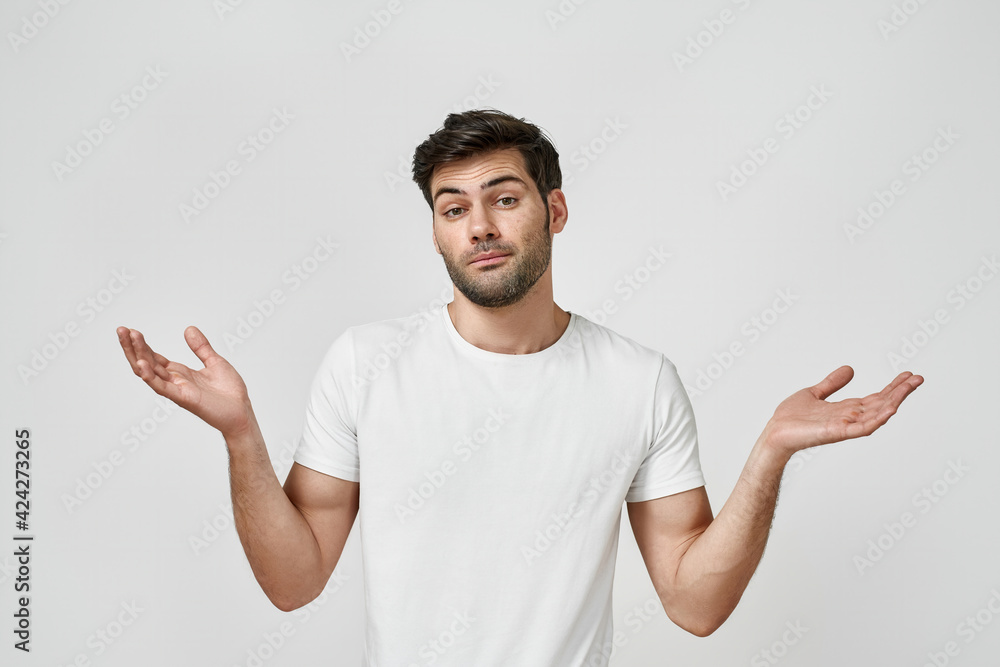 Man wearing t-shirt spreading his arms to the side Man wearing t-shirt spreading his arms to the side