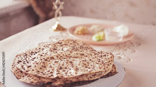 The matsa shmura on the table for the Easter seder rotates in a circle photo