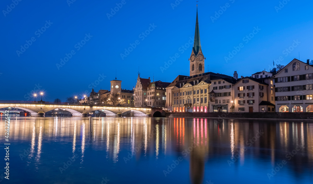 View of skyline of the swiss city Zurich and reflections on the Limmat river View of skyline of the swiss city Zurich and reflections on the Limmat river