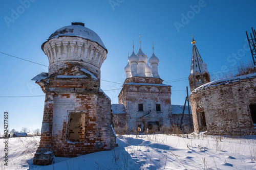 Pokrovskaya Church in the village of Dunilovo, Ivanovo region on a sunny winter day. photo