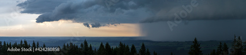 travel germany and bavaria, view over bavarian landscape while weather is changing from sun to rain
