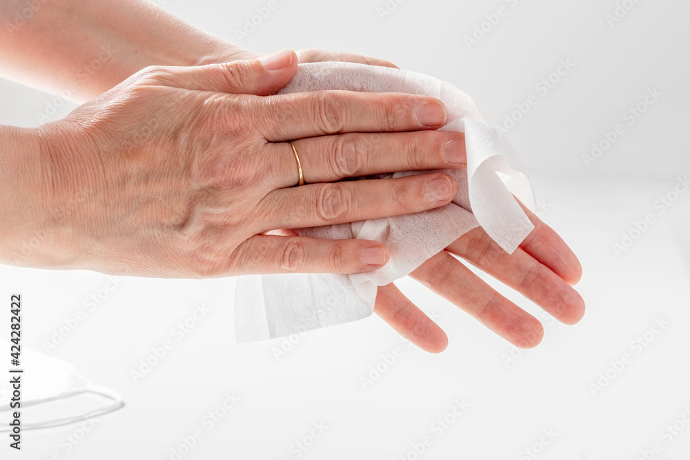 A man wipes his hands with a disinfectant napkin. Close-up. Hygiene. A man wipes his hands with a disinfectant napkin. Close-up. Hygiene.