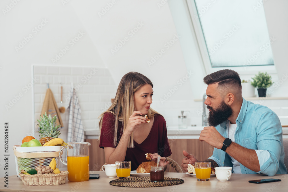 Couple having breakfast at home