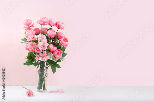 Holiday concept with flowers, spring or summer composition, still life, flowers in a vase, banner. Mother's day card, happy birthday, wedding, flower shop advertisement,