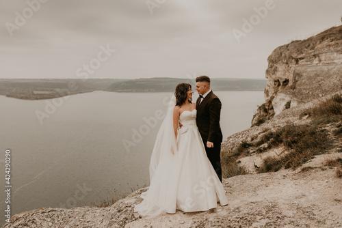 Wallpaper Mural couple wedding bride groom man and woman on rocks above cliff Torontodigital.ca