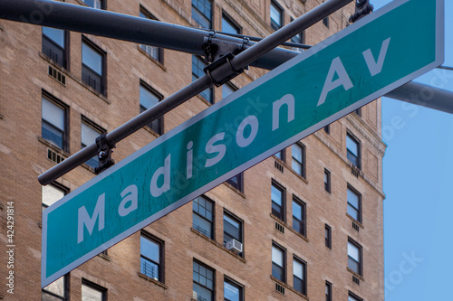 Canvas Print hanging green and white city street sign of Madison ave, avenue