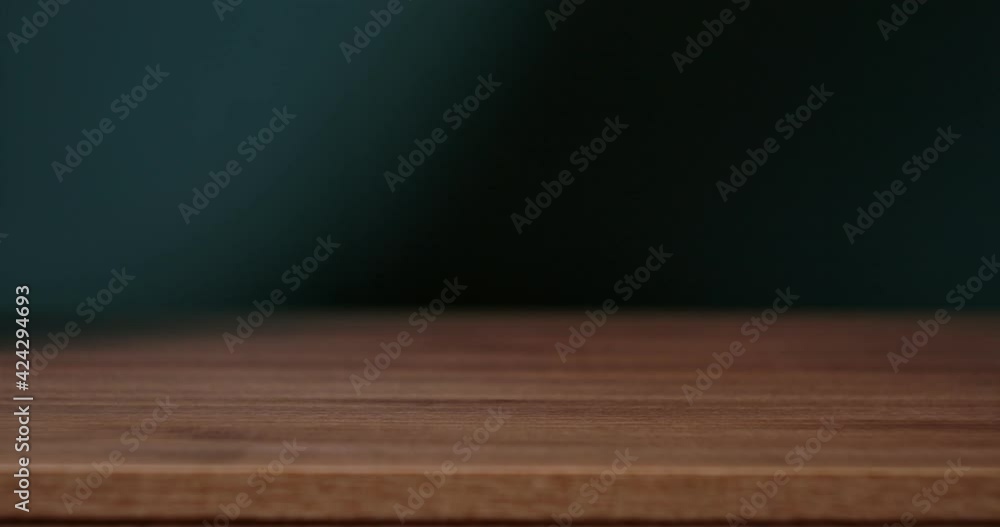 Unrecognizable woman laying beautiful tablecloth on wooden table Unrecognizable woman laying beautiful tablecloth on wooden table