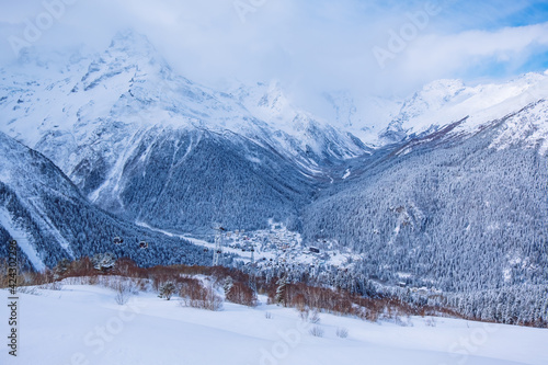 Downhill skiing resort in high mountains, aerial view