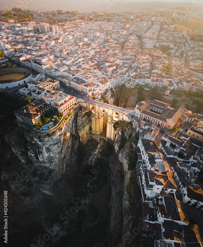 Aerial view of Puente Nuevo, an historical bridge and museum with Ronda townscape in background during sunset, Ronda, Spain. photo