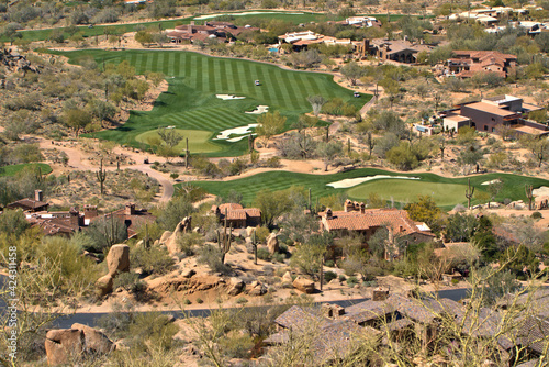 View from Pinnacle Peak trail in Scottsdale, Arizona over looking a golf course photo
