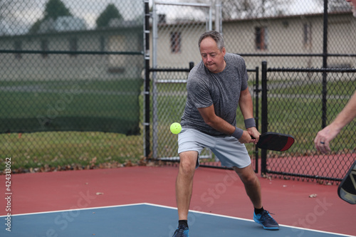 Quadro em tela A pickleball player hits a two handed backhand