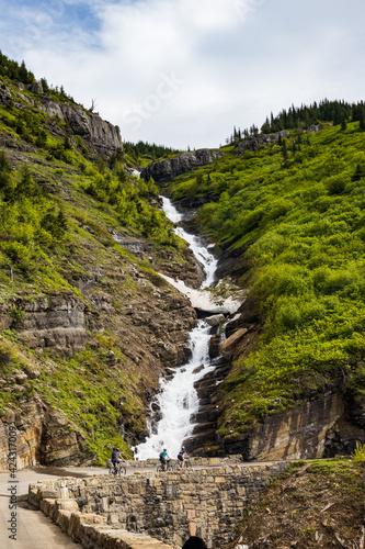 Going-to-the-Sun Road with roadside waterfall  Glacier National Park  Montana