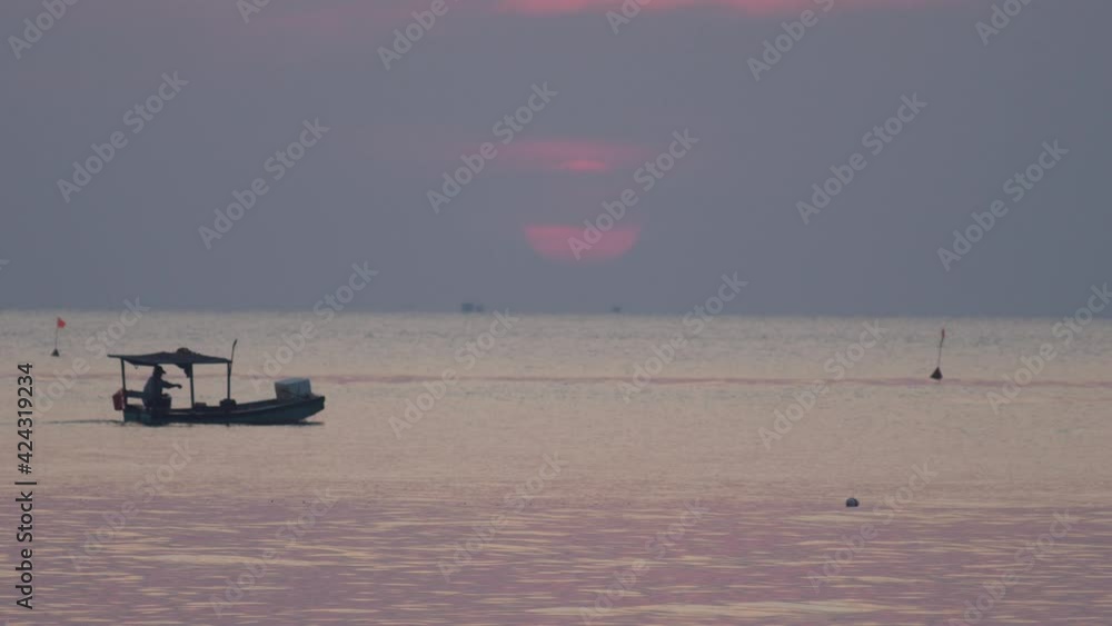 Cinematic of a fisherman travelling on boat in the sea at dusk. Cinematic of a fisherman travelling on boat in the sea at dusk.