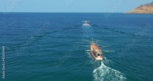 Fishing Boats Aerial View Drone. Small Ships Floats on Sea Surface Leaving a Path of Sea Foam Water