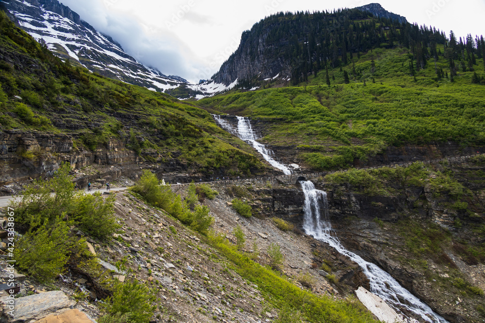 Going-to-the-Sun Road with roadside waterfall, Glacier National Park, Montana