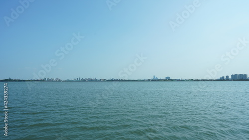 The panoramic lake view with the peaceful water and blue sky © Bo