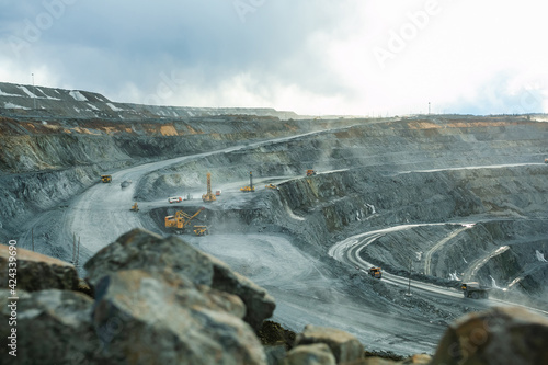 Work of heavy equipment in an open pit