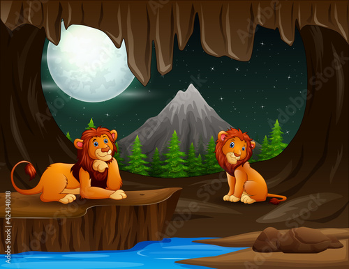 Scene with two lions in the cave at night