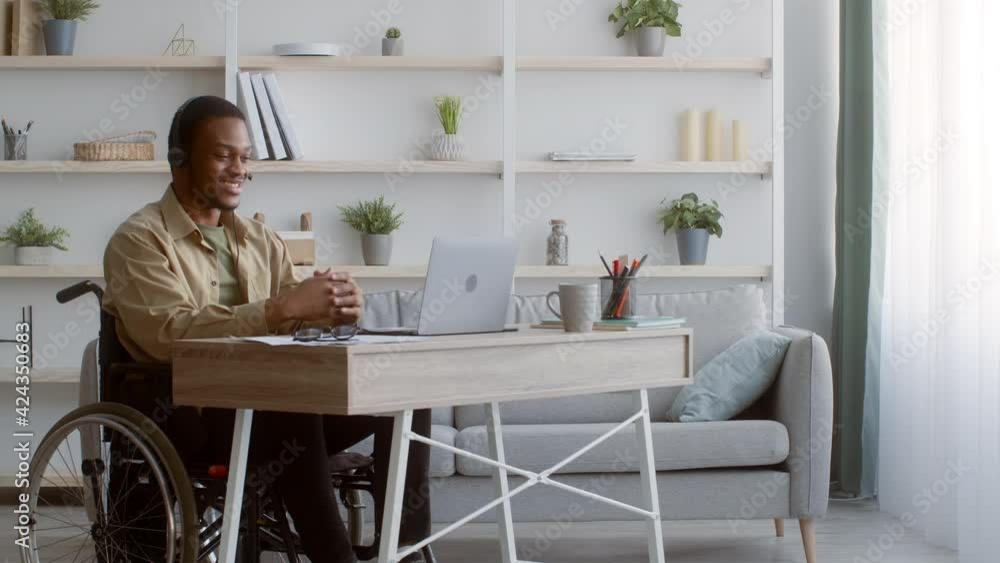 Disabled Black Man In Wheelchair Video Calling Using Laptop Indoors Disabled Black Man In Wheelchair Video Calling Using Laptop Indoors