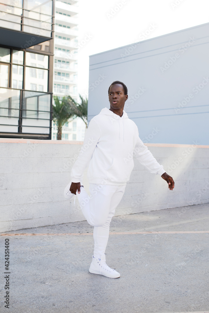White trendy hoodie street style menswear full body fashion shoot