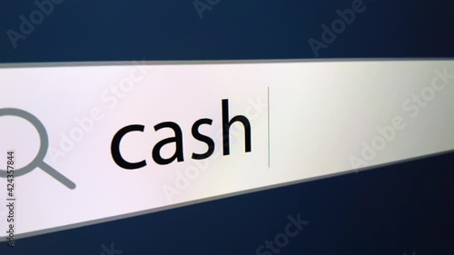Cash back written in search bar with cursor ,a computer monitor, close-up with the effect of a camera zoom