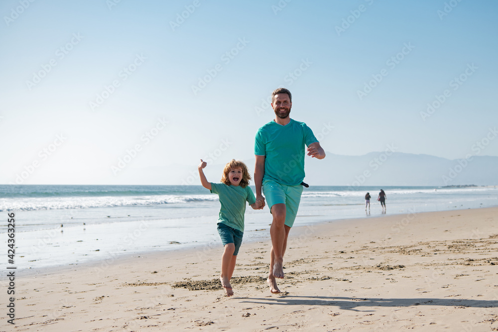 Father and son running on summer beach. Family travel, vacation, father's day concept. Father and son running on summer beach. Family travel, vacation, father's day concept.