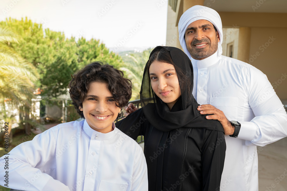 Arabian family of father, Brother, and daughter smiling