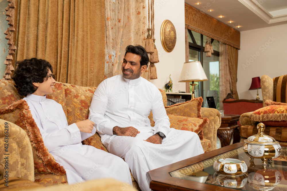 Arabian father and Son having a conversation . Arabian father and Son having a conversation .