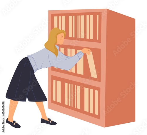 Woman reaching books on shelf in library or shop