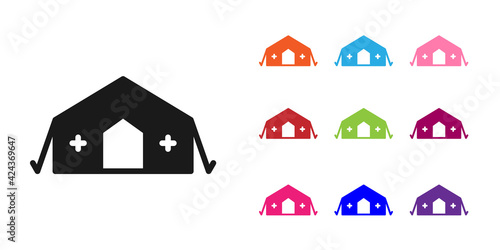 Black Military medical tent providing first aid to a patient icon isolated on white background. Medical tent free aid to people. Set icons colorful. Vector