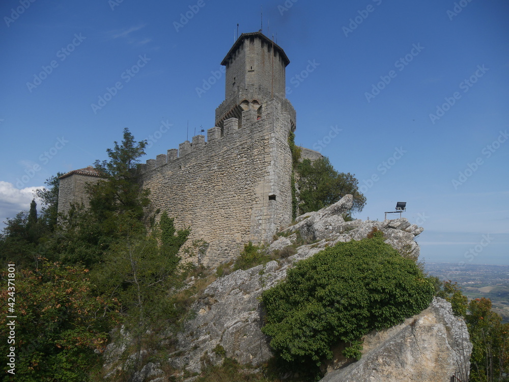 San Marino, First Tower. Rear of the castle positioned on a rock overlooking the surrounding area and surrounded by mighty stone walls.